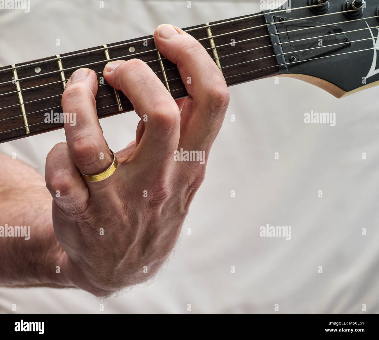 On the Fretboard, playing chords Stock Photo