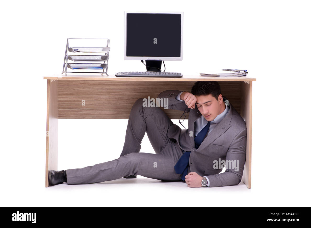 Person hiding under desk hi-res stock photography and images - Alamy