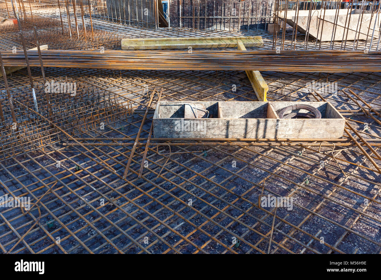Construction workers fabricating steel reinforcement bar at the