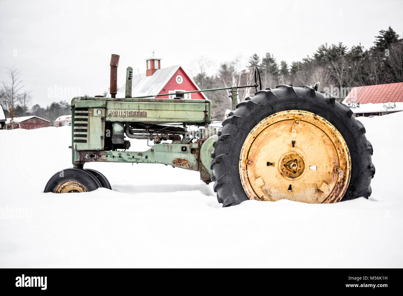 An old John Deere antique tractor in the snow. Quechee, Vermont Stock Photo Alamy