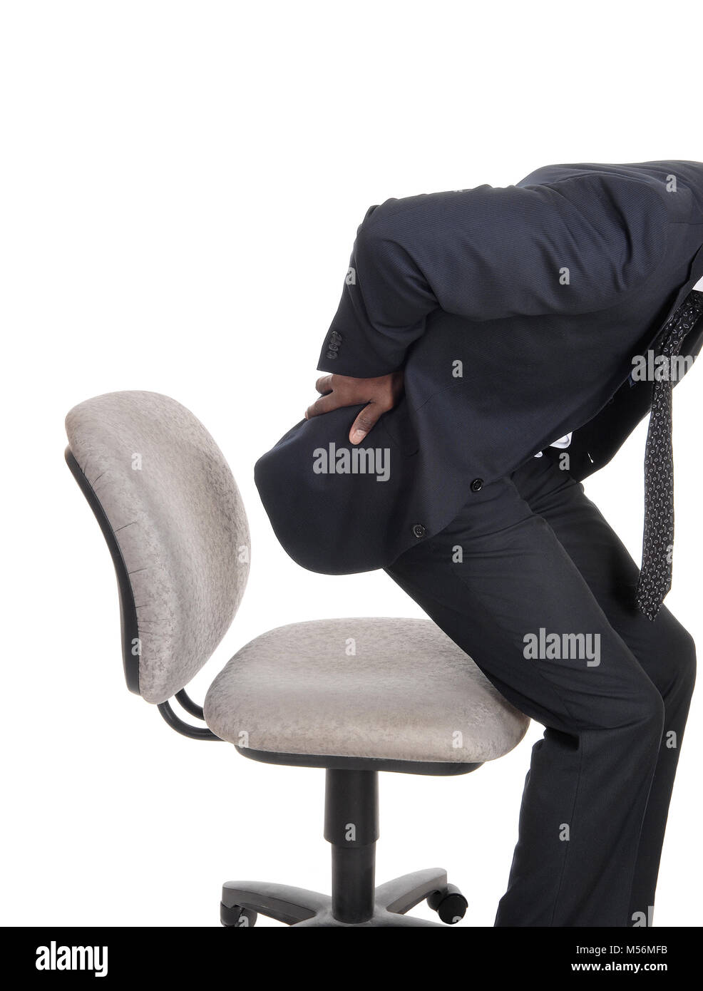 Man with back pain getting up from chair Stock Photo Alamy