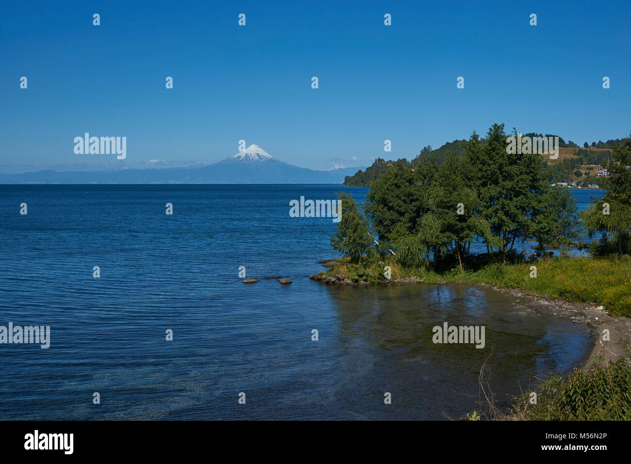 Snow capped Volcano Osorno (2,652 metres) on the edge of Llanquihue Lake in Southern Chile. Viewed from Frutillar. Stock Photo