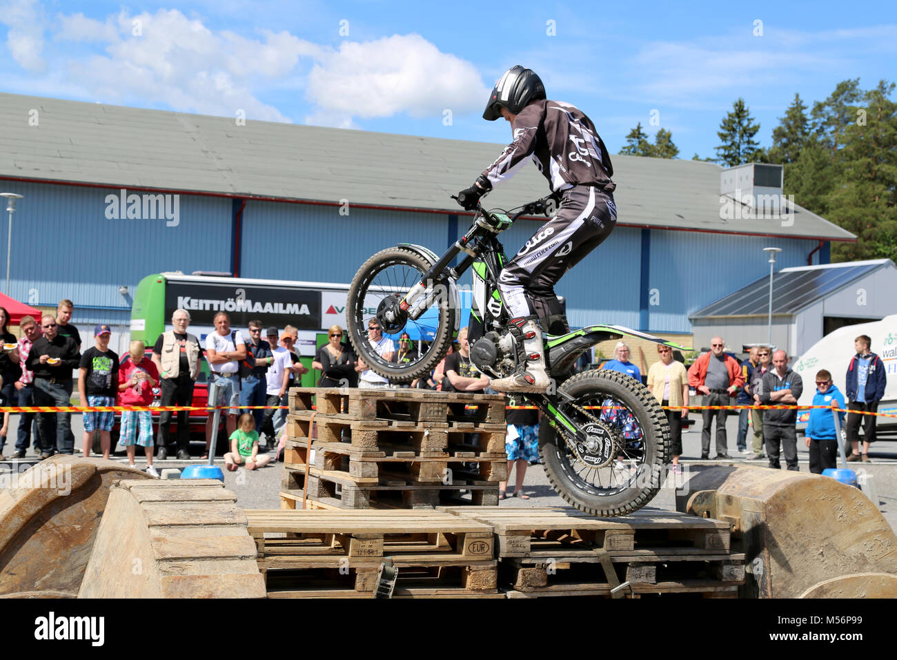 LOIMAA, FINLAND - JUNE 15, 2014: Finnish Champion Timo Myohanen gives the audience an exciting show in Motorcycle Trials at HeMa Show 2014 in Loimaa,  Stock Photo