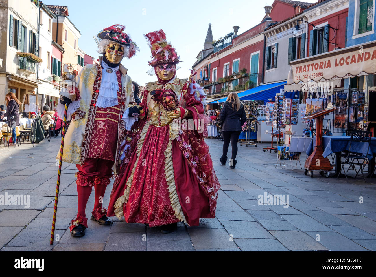 Man and woman wearing red costume during the Carnival of Venice 2018. Venice, Italy. February 2018. Stock Photo