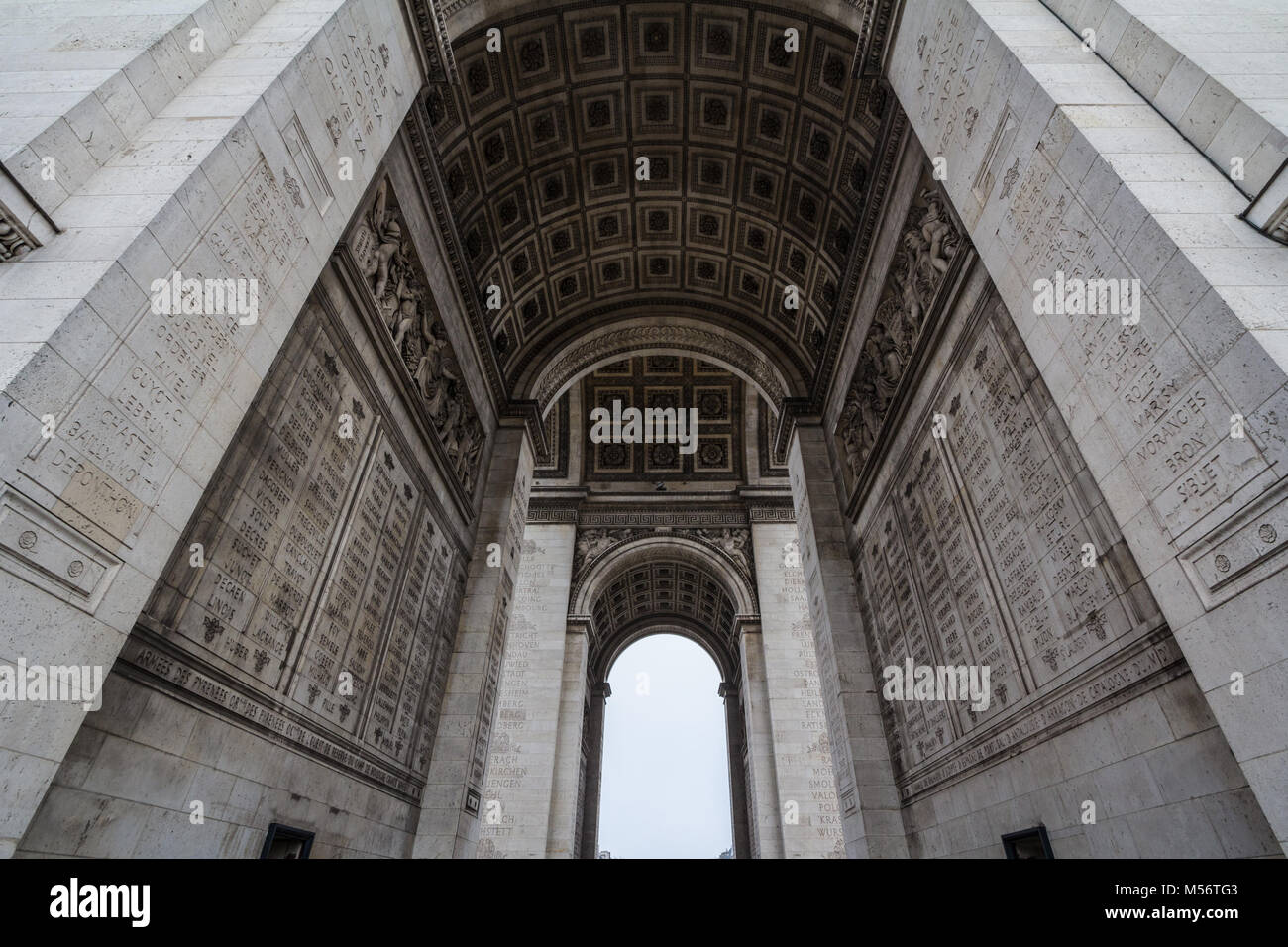 Arc de Triomphe (Triumph Arch, or Triumphal Arch) on place de l'Etoile in Paris, taken from below. It is one of the most famous monuments in Paris, st Stock Photo