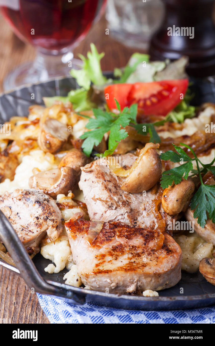 pork fillet on spaetzle with mushrooms Stock Photo Alamy