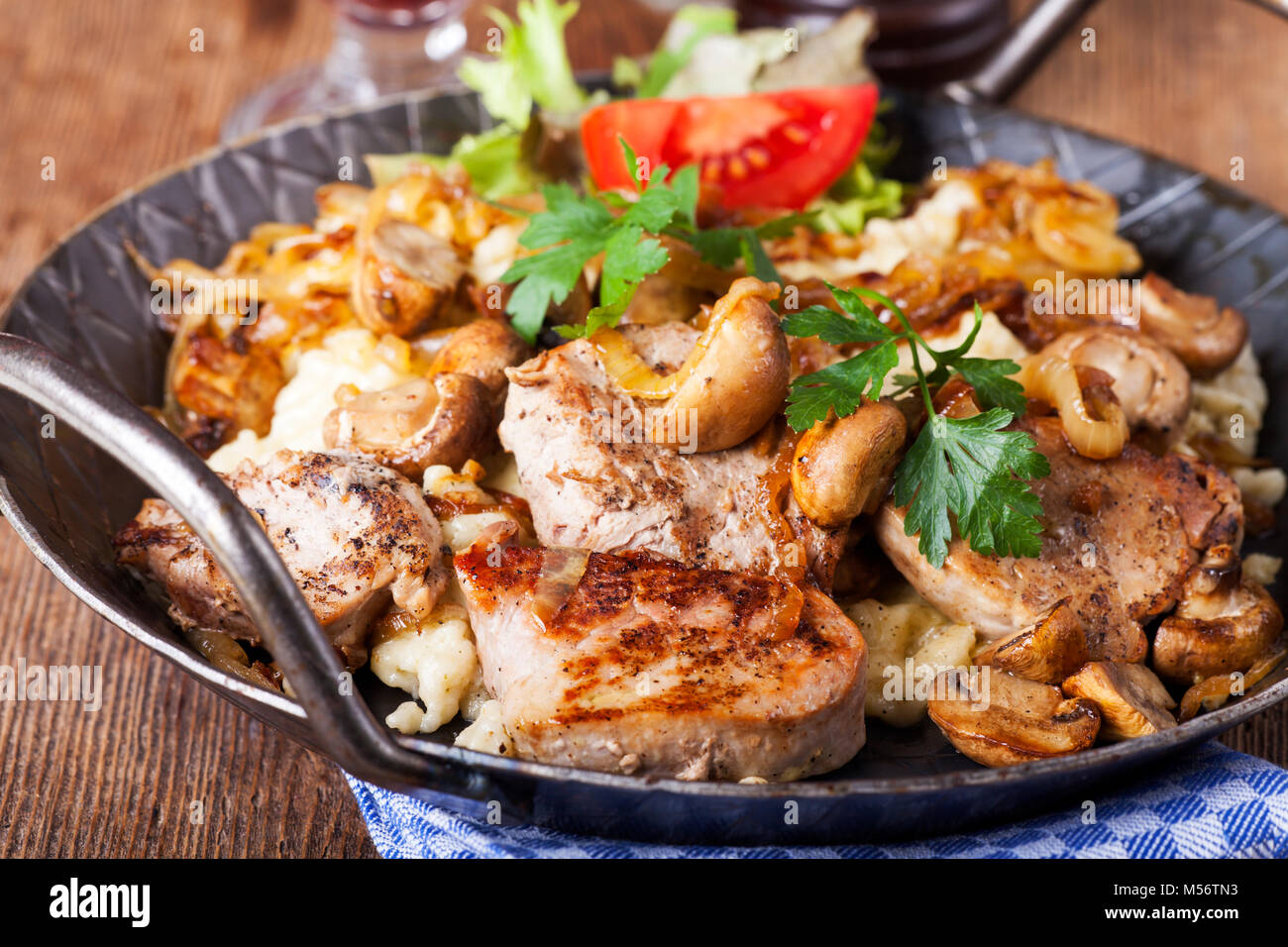 pork fillet on spaetzle with mushrooms Stock Photo Alamy
