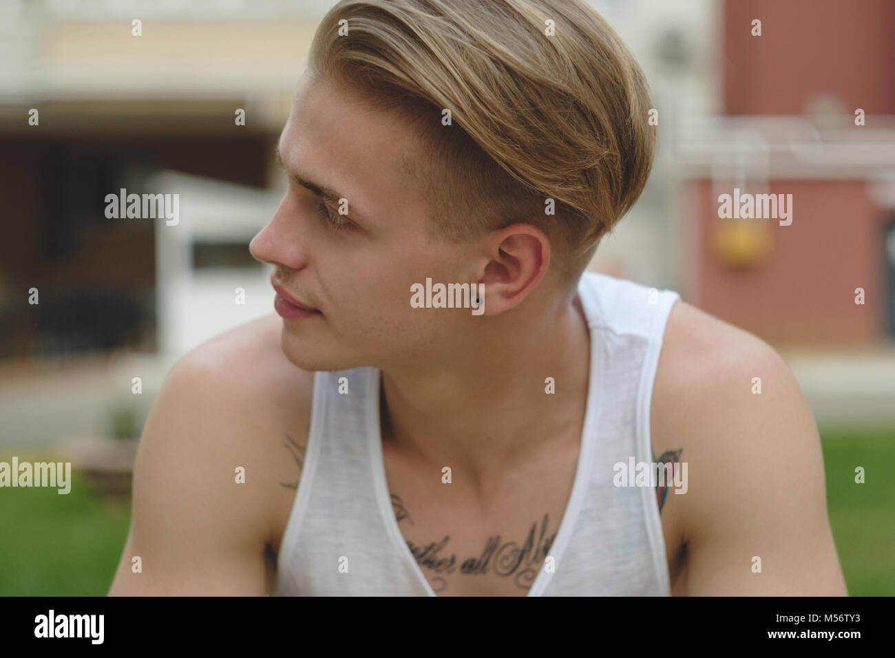 Portrait Blonde Hipster Boy With Tattoos And Stylish Hair Stock