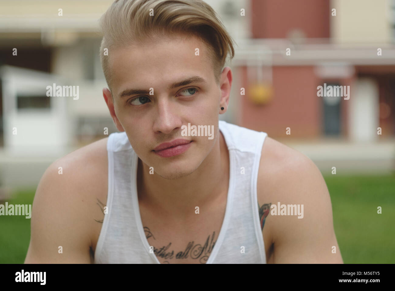 Portrait Blonde Hipster Boy With Tattoos And Stylish Hair Stock