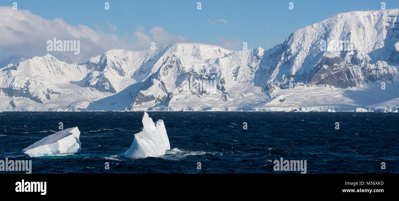Antarctica, Antarctic Peninsula. Panoramic countryside view sailing north from the Lemaire Channel. Stock Photo