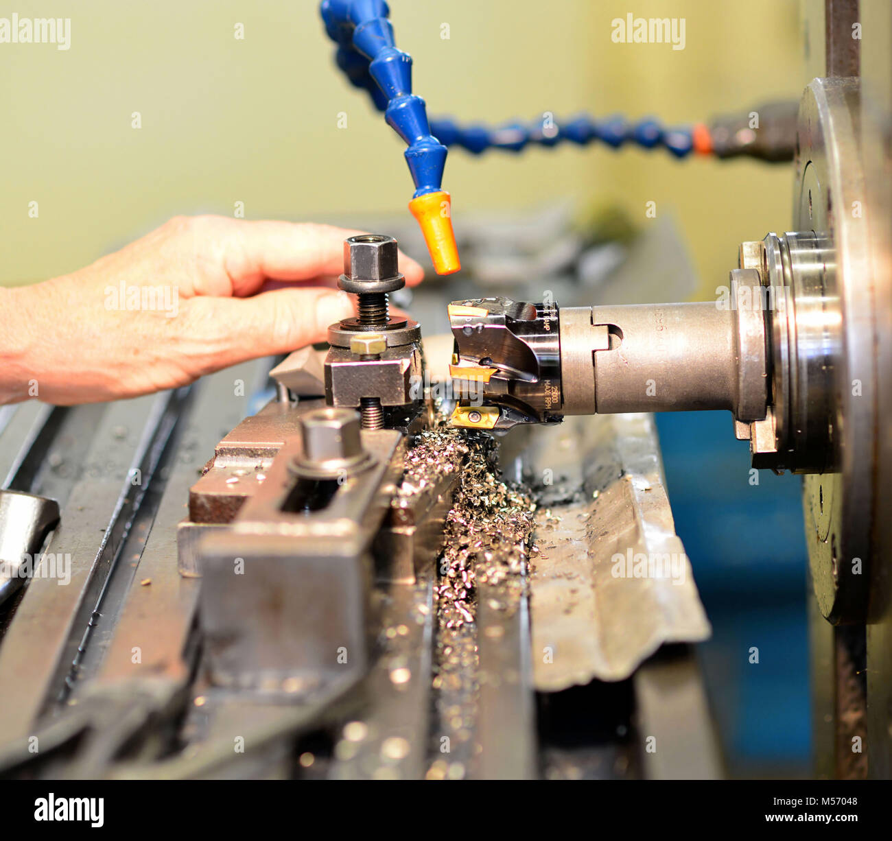 cnc milling machine machining metal work piece in an industrial company for mechanical engineering Stock Photo