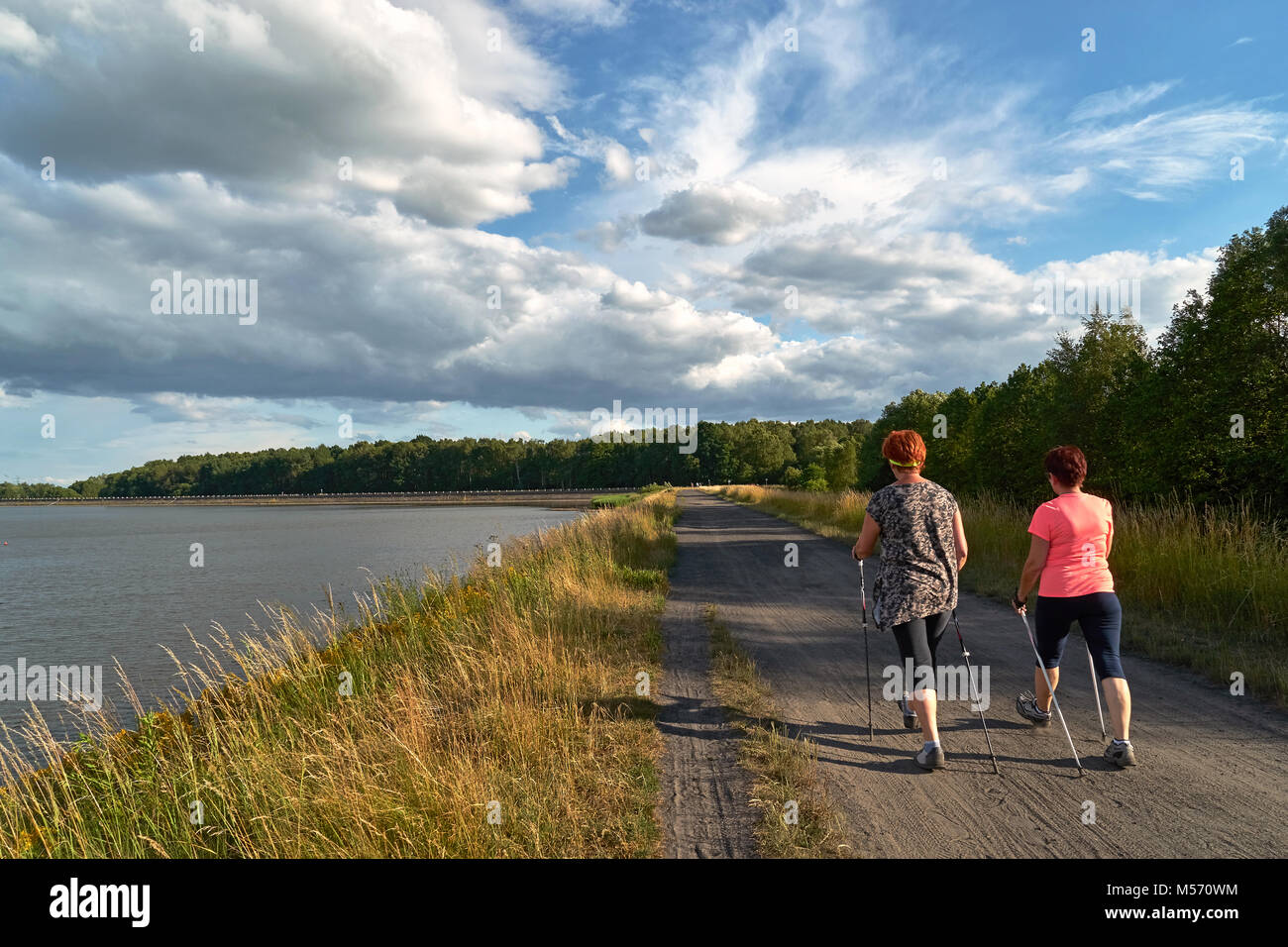Mature woman walking poles hi-res stock photography and images - Alamy