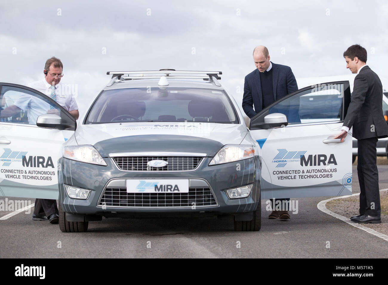 The Duke of Cambridge enters the passenger seat of the MIRA ADAS autonomous vehicle during a visit to the MIRA Technology Park in Nuneaton, Warwickshire, which supplies pioneering engineering, research and test services to the transport industry. MIRA was formerly known as the Motor Industry Research Association. Stock Photo