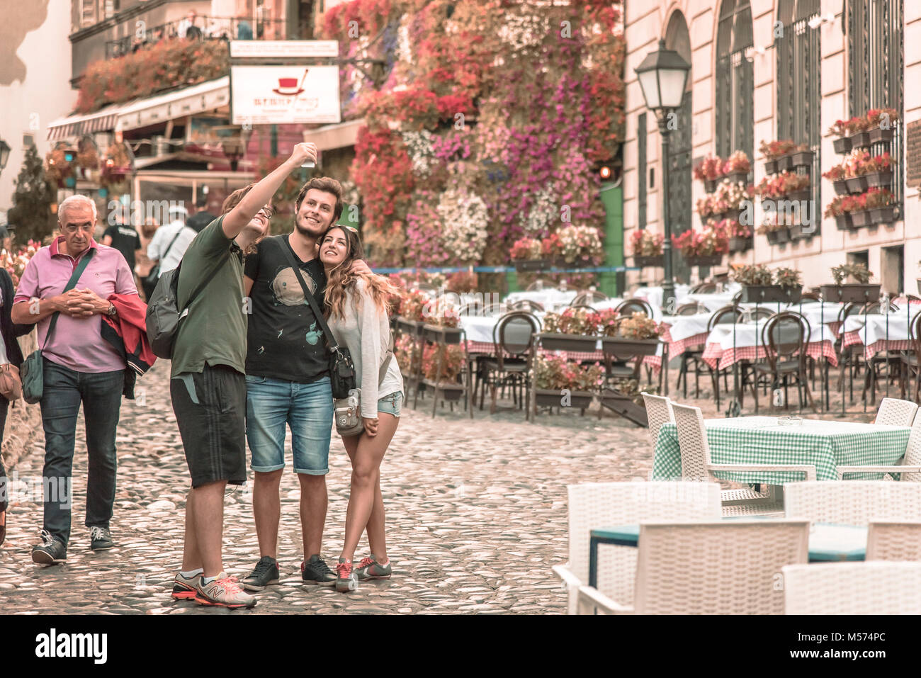 Tourists taking pictures in Skadarlija, Serbia Stock Photo