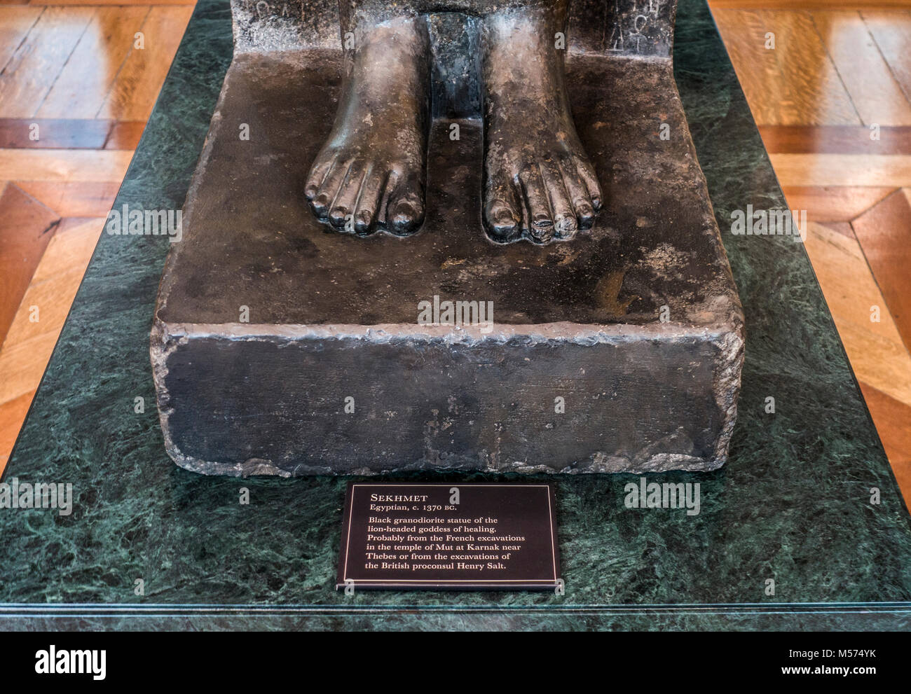 The feet of Sekhmet - black granodiorite, Egyptian, lion-headed goddess statue. British Museum (human history, art and culture). London, England, UK. Stock Photo