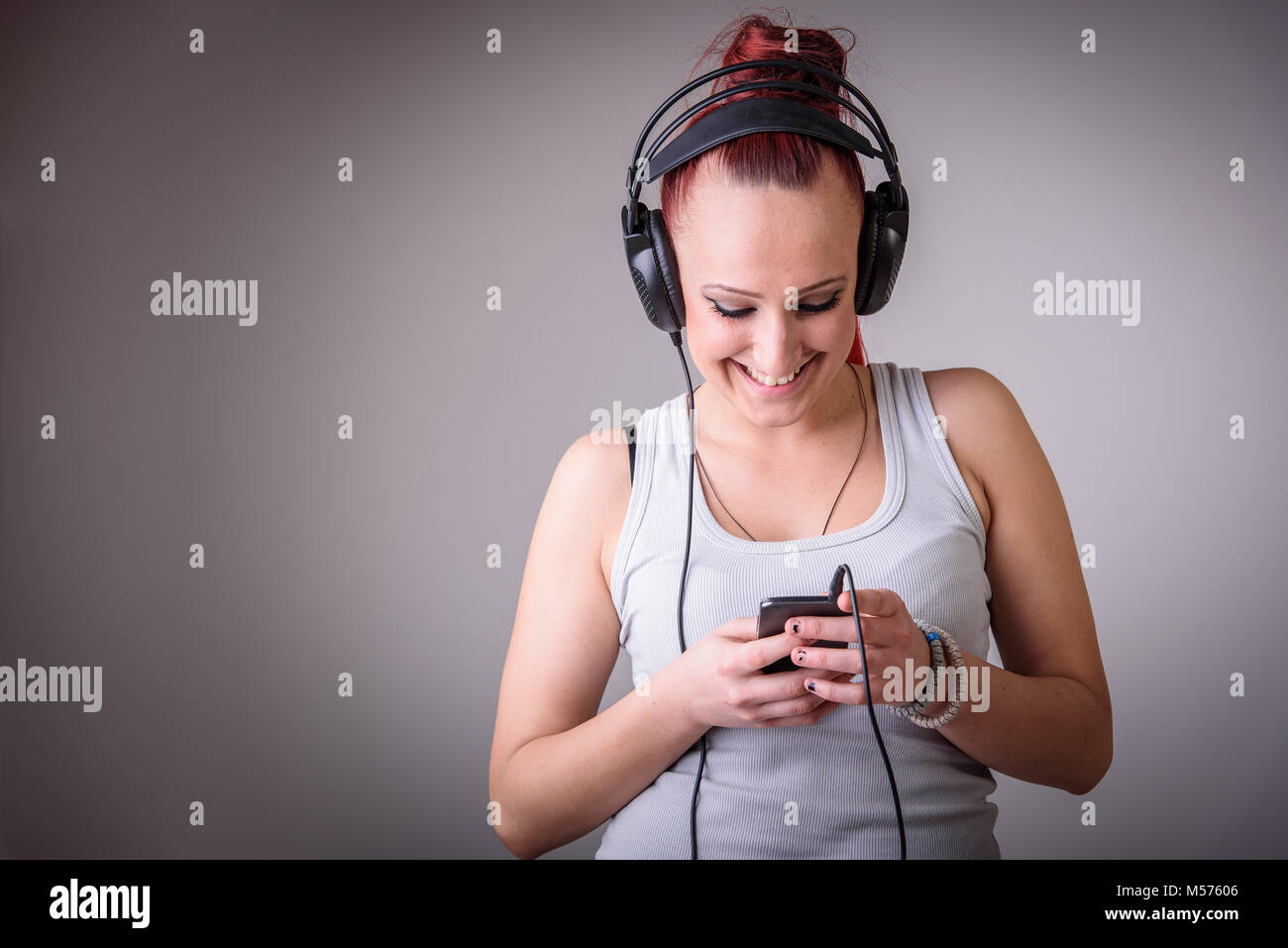 Sporty young woman dancing to music Stock Photo