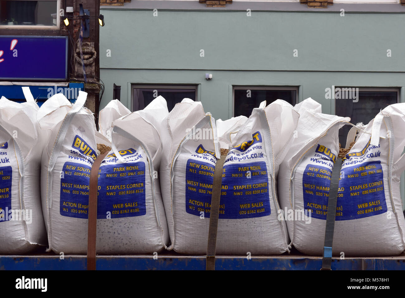 1 ton bags of builders sand or stone agregates on the back of a