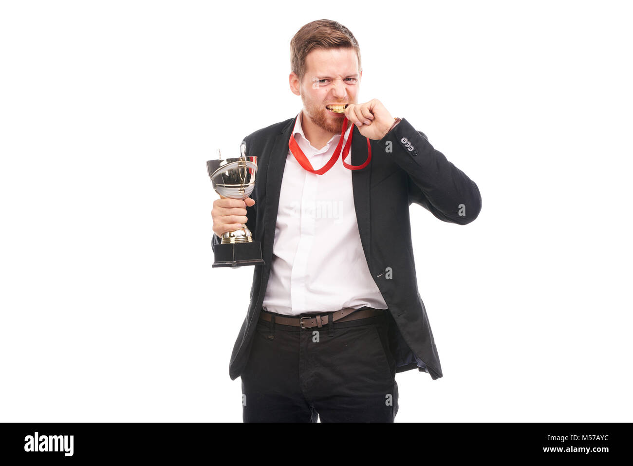 Businessman holding trophy Stock Photo