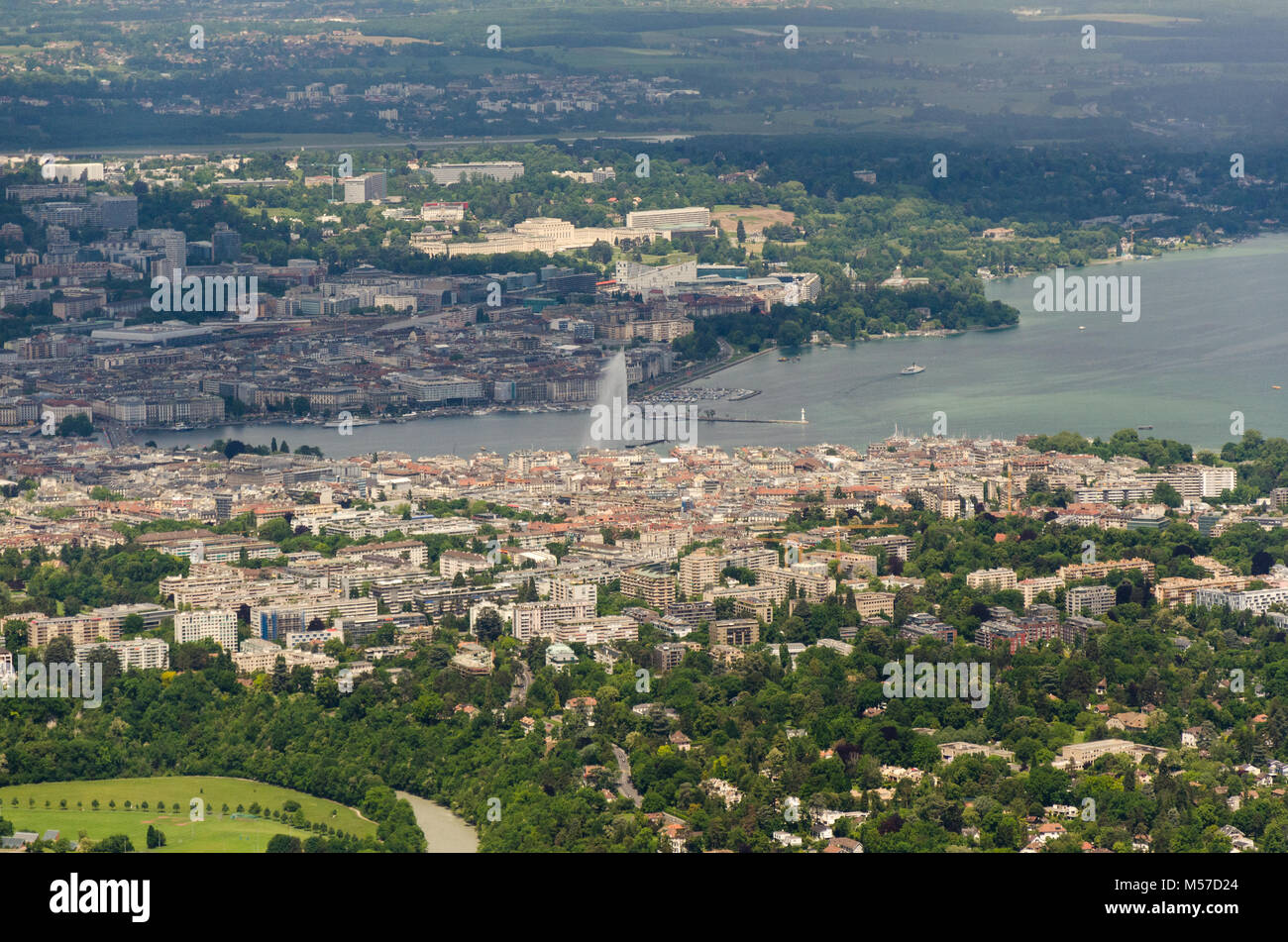 Aerial view of Geneva and its Jet d'Eau in Lake Geneva from Mont Salève in France. Stock Photo