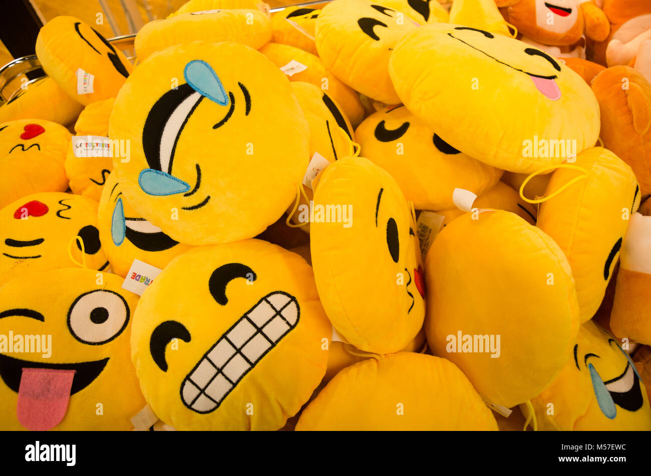 Full frame of variety of WhatsApp emoticon sofa cushion pillows kept for sale. Stock Photo