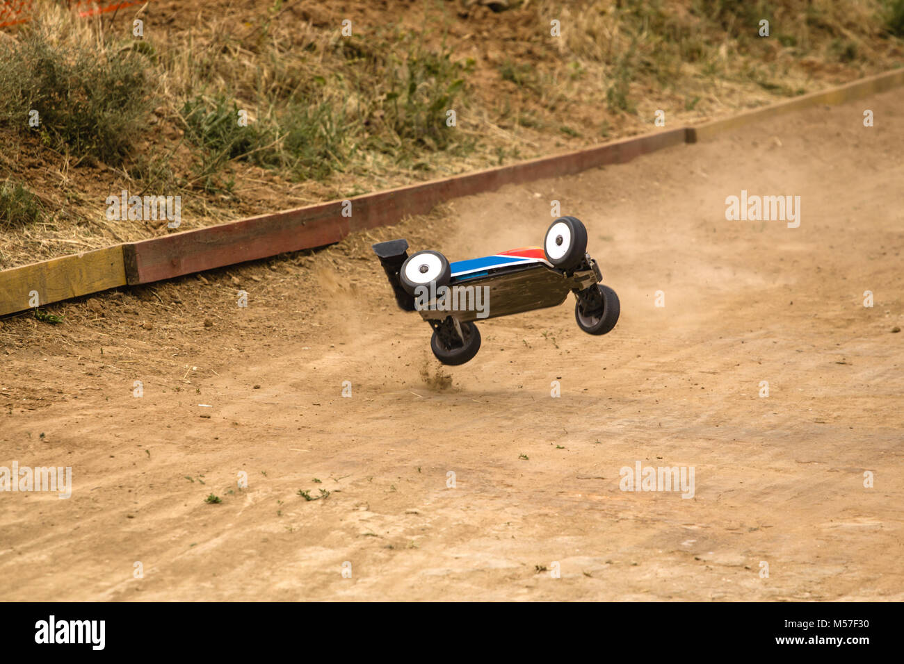 Radio controlled car model in race on dirt track Stock Photo Alamy