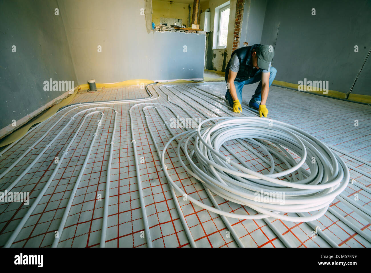 Pipefitter installing system of heating Stock Photo