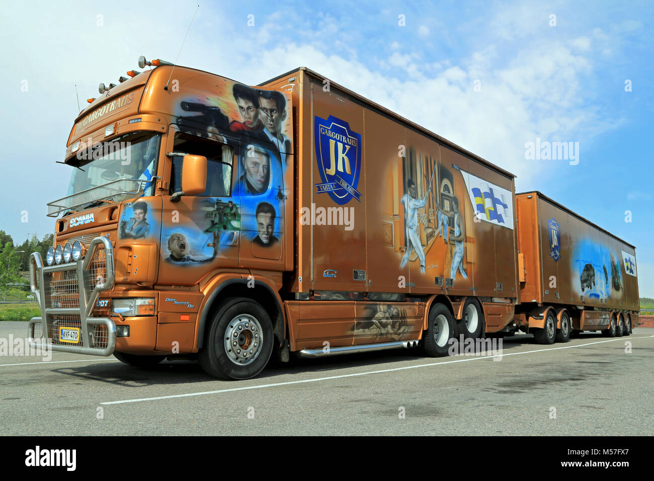 SALO, FINLAND -  MAY 25, 2014: Scania trailer truck with scenes from the James Bond film Die Another Day. Transportation and art meet in the world of  Stock Photo