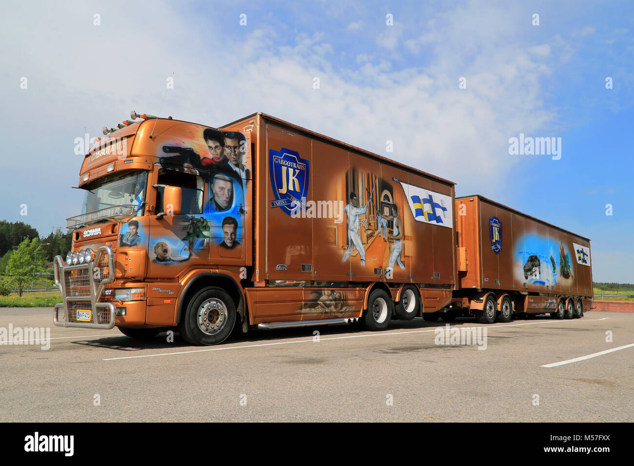 SALO, FINLAND -  MAY 25, 2014: Scania trailer truck with scenes from the James Bond film Die Another Day. Transportation and art meet in the world of  Stock Photo