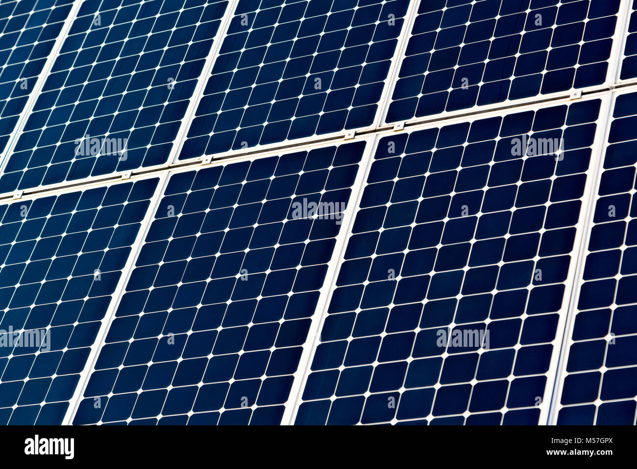 Solar power photovoltaic panel or battery of dark blue cells to generate electical energy. Ecologically clean generator, renewable source of energy Stock Photo