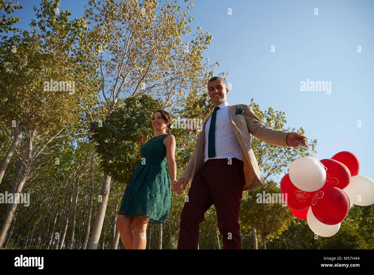 Couple with balloons Stock Photo - Alamy