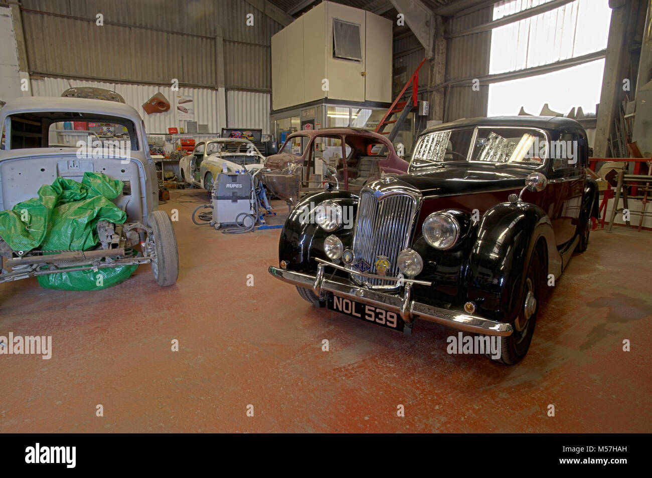 Classic car workshop filled with projects Stock Photo Alamy