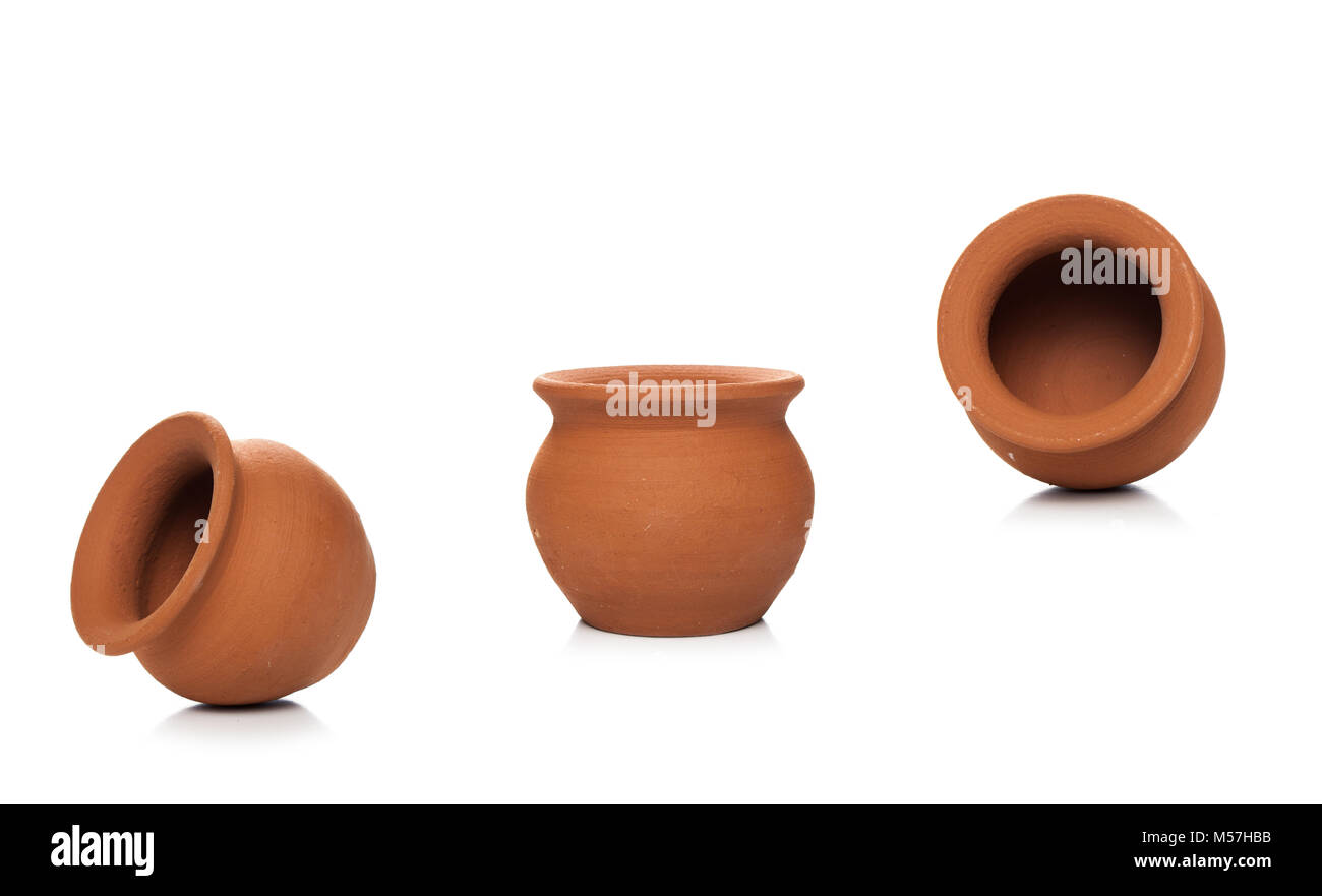 Clay pots used since ancient times on white background.soft clay pot isolated. Stock Photo