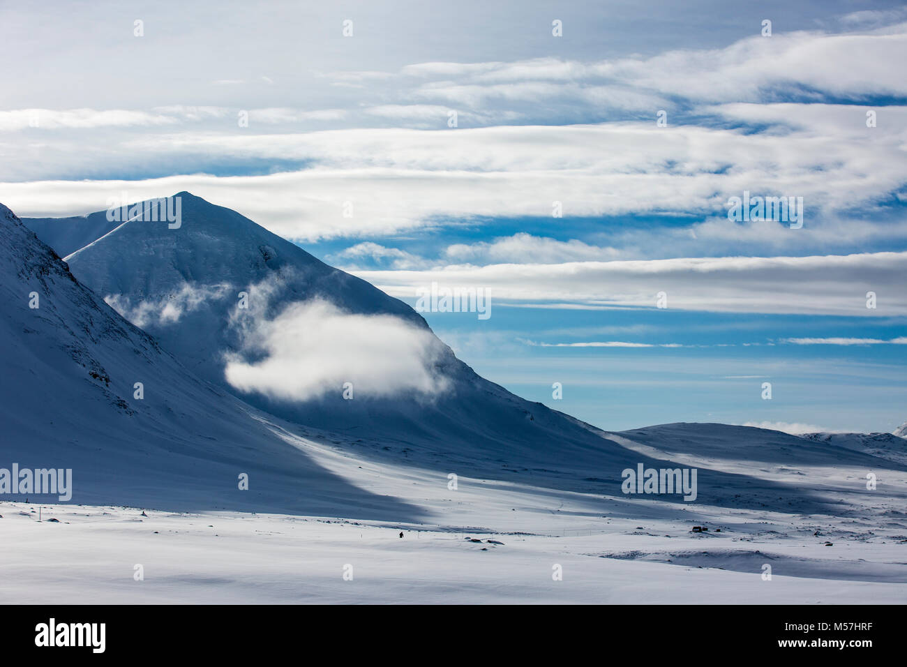 Cloud between mountains in the snow,Tjäktja-Pass,Kungsleden or king's trail,Province of Lapland,Sweden,Scandinavia Stock Photo