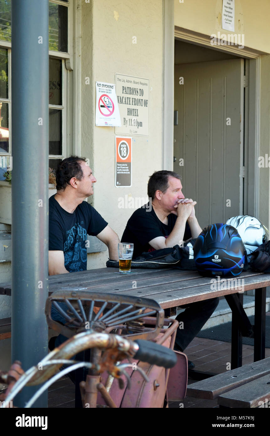 Two men drinking outside pub. Kangaroo Valley NSW Australia Stock Photo