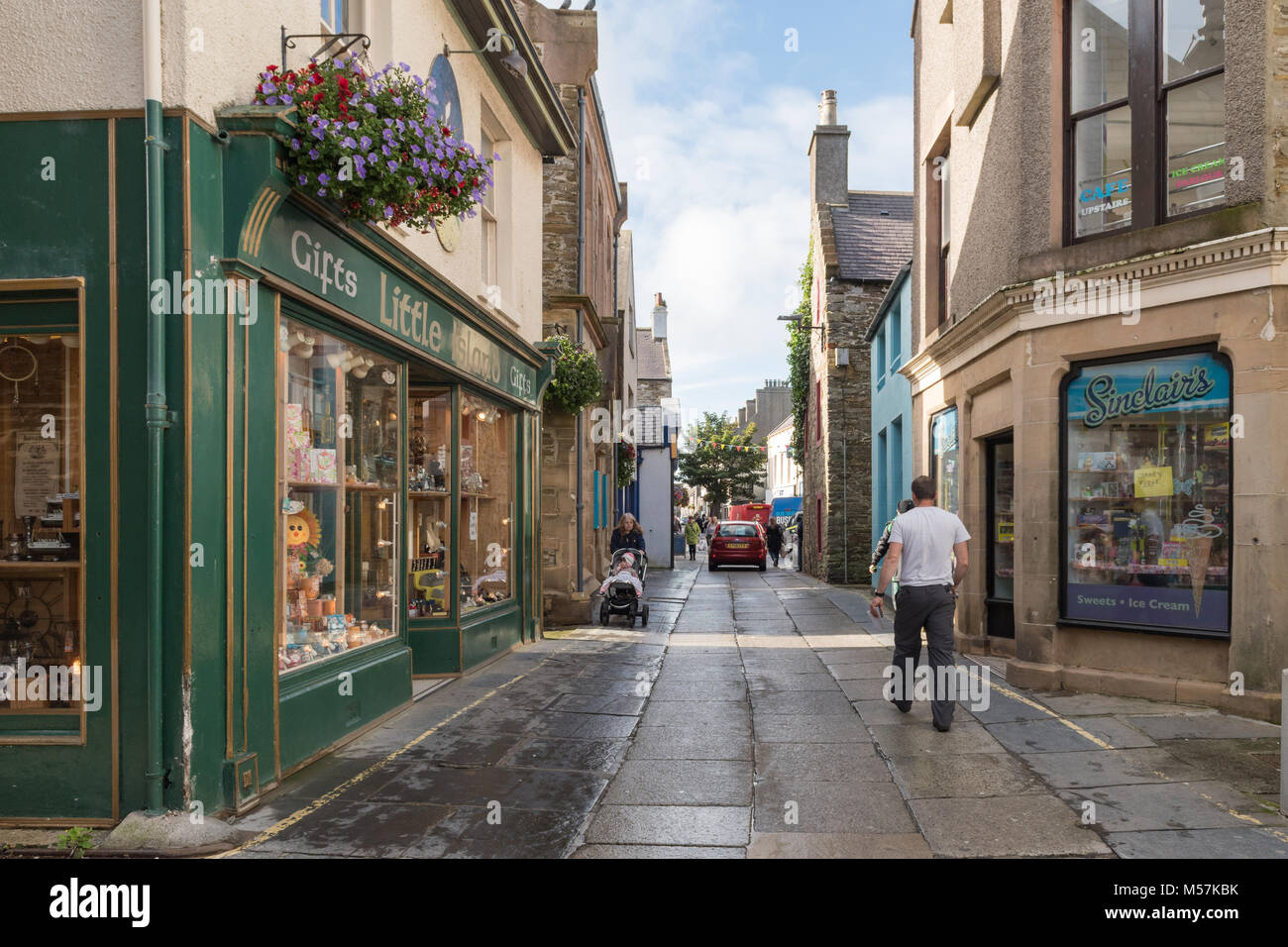 Albert Street, Kirkwall cars, pedestrians and The Big Tree, Orkney