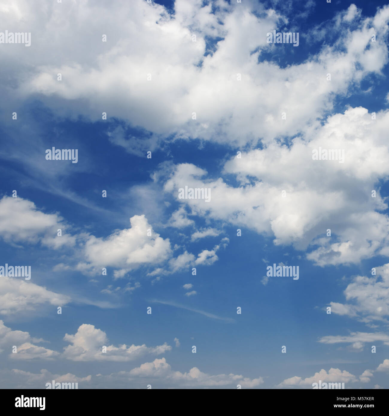 white clouds on a dark blue sky background Stock Photo - Alamy