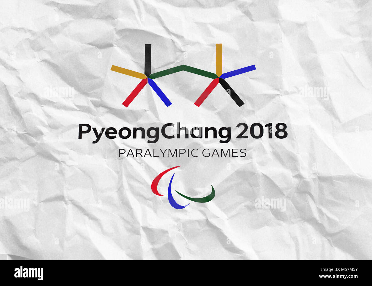 14 December 2017 Moscow, Russia Symbols XII Winter Paralympic Games in Pyeongchang, Republic of Korea on a sheet of crumpled paper Stock Photo
