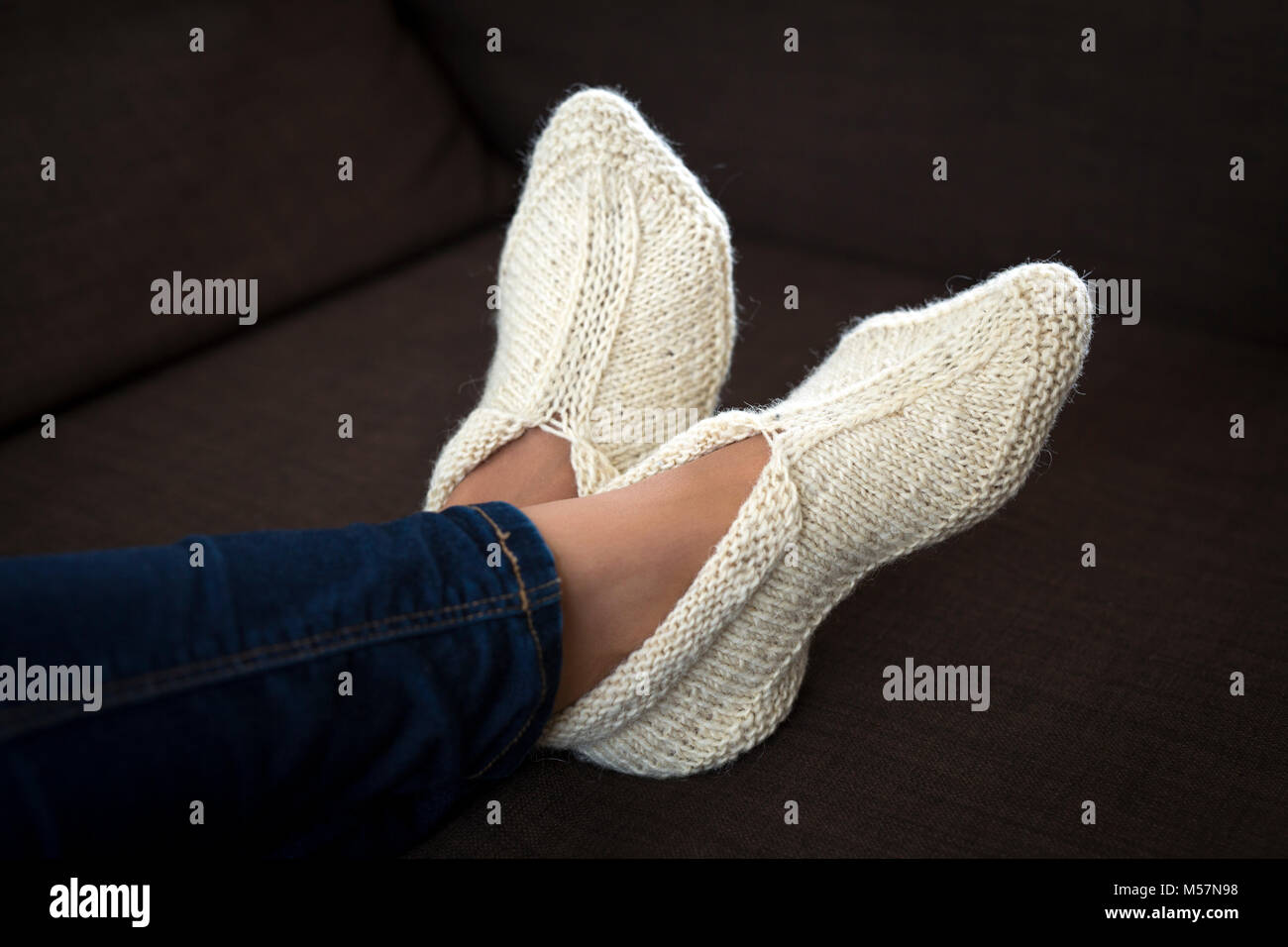A typical production of the Balkans's handicrafts: woollen slippers knitted by hand. Artisanat des Balkans: chaussons en laine tricotés main. Stock Photo