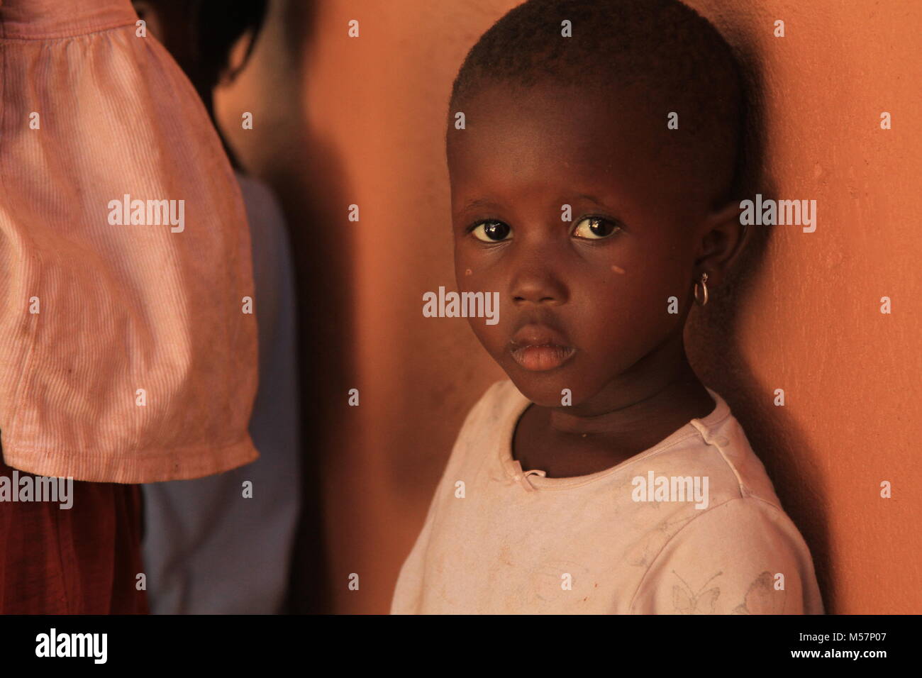 A girl with bright eyes in Kampala, Uganda. Stock Photo