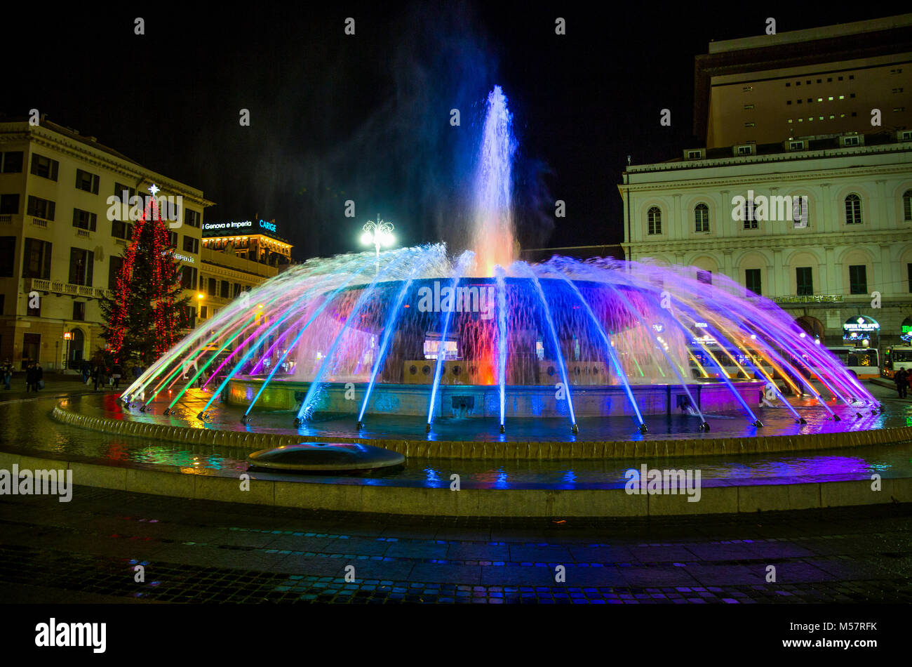 GENOA, (GENOVA) ITALY - DECEMBER 28, 2016. Panoramic view of the colorful fountain of De Ferrari square by night in Genoa, the heart of the city. Stock Photo
