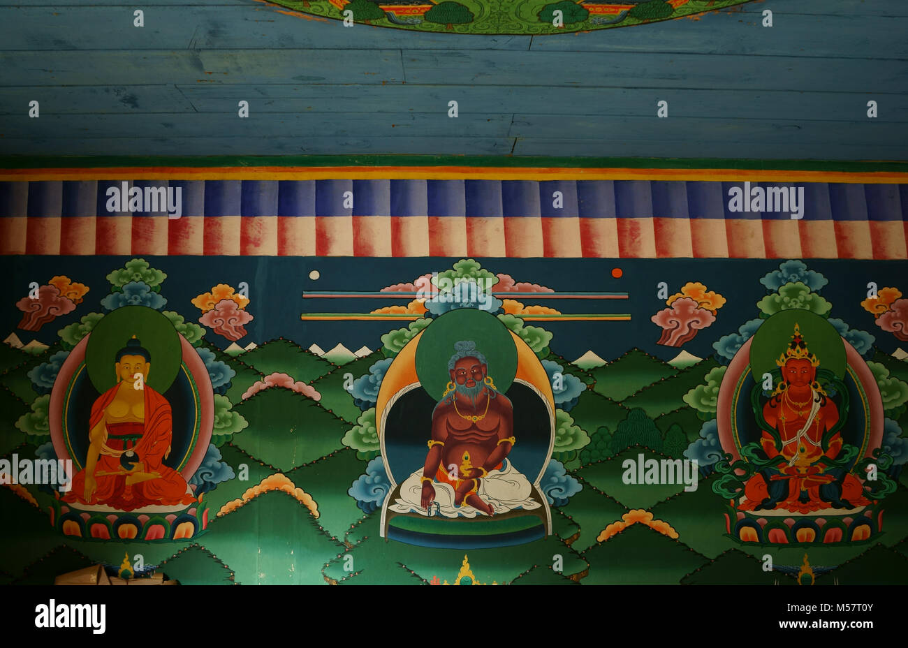 Buddhist gods with god of Blacksmith in center, Tower of historic Tachog Lhakhang Iron Chain Bridge, Paro valley, Bhutan Stock Photo