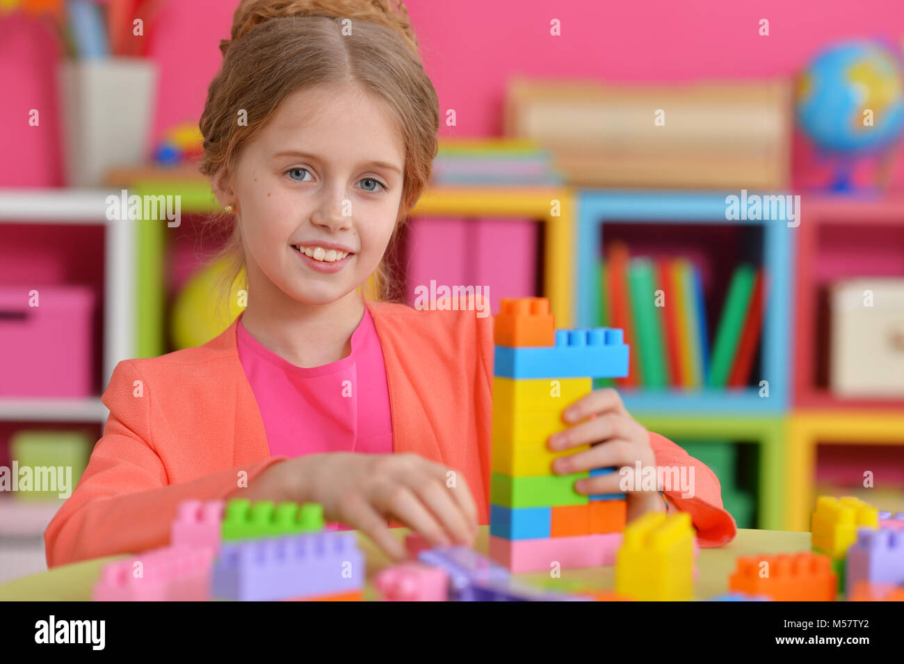 girl playing with plastic blocks Stock Photo - Alamy