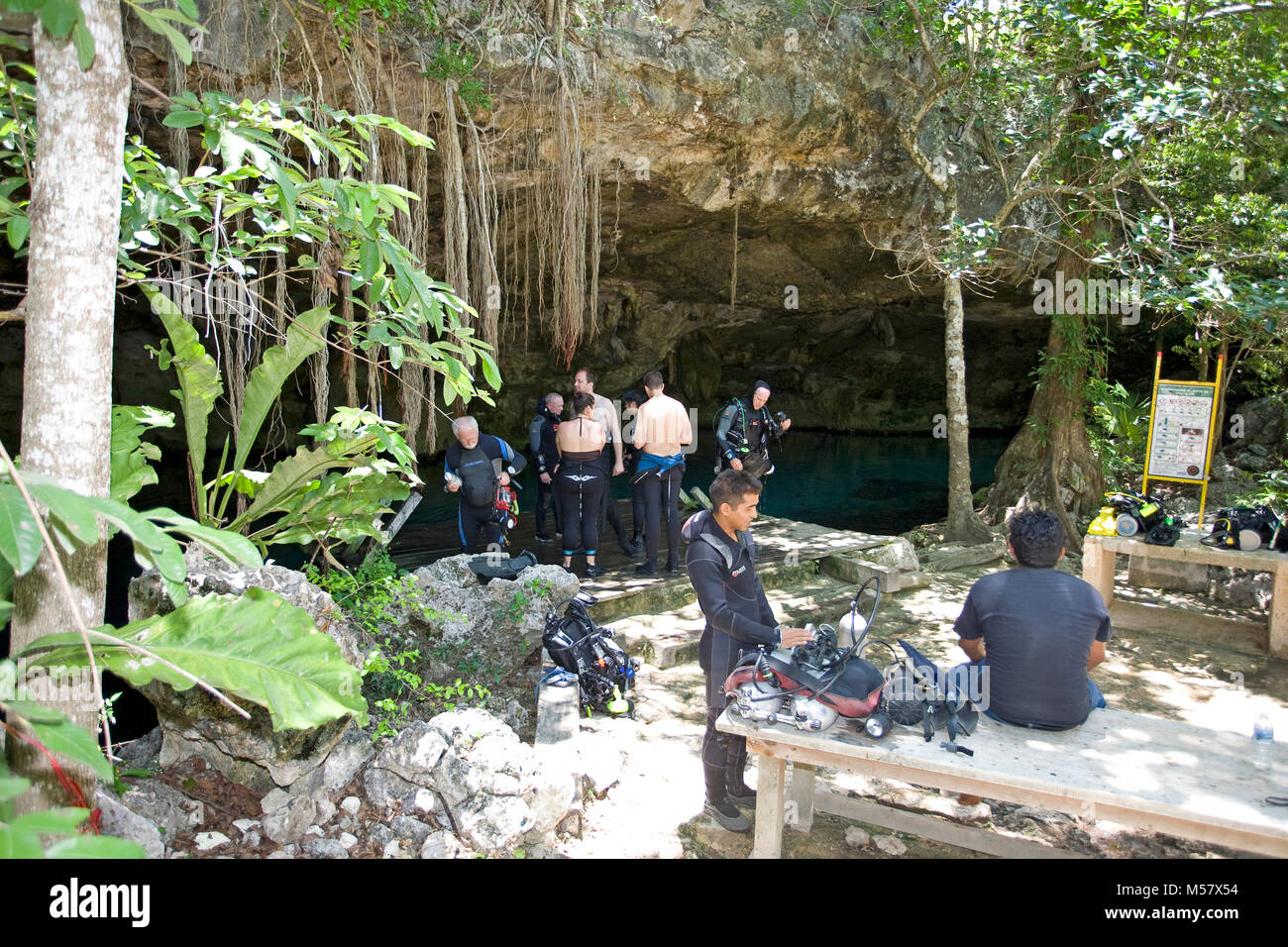 Cave diver preparing their equipment for a dive in Cenote Dos Ojos ...