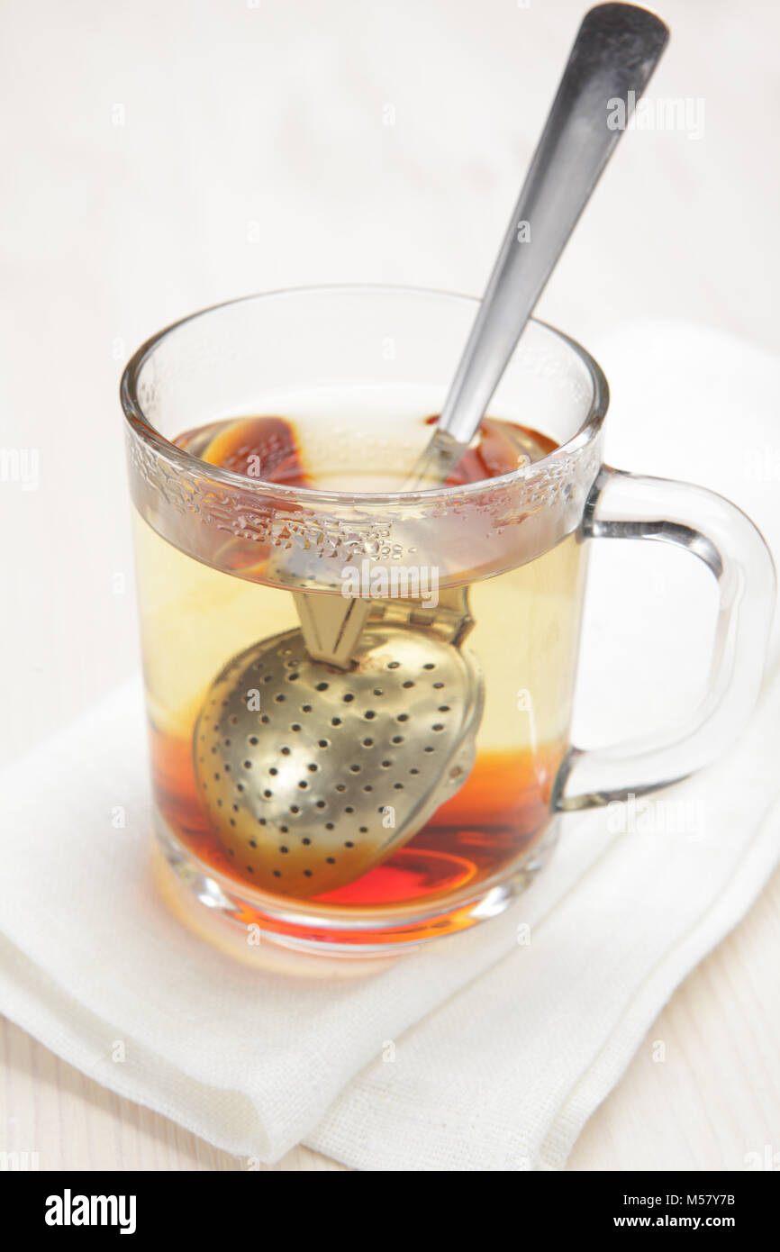 Making black tea using tea infuser spoon Stock Photo Alamy