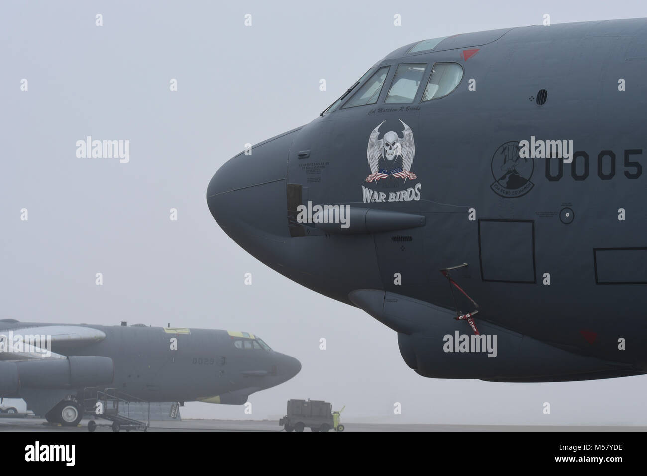 Two Boeing B-52H Stratofortress aircraft undergoing maintenance, repair and overhaul at the Oklahoma City Air Logistics Complex, are shown in foggy conditions during the morning of Feb. 14, 2018, Tinker Air Force Base, Oklahoma. OC-ALC is a subordinate unit of the Air Force Sustainment Center and is the complex responsible for bomber, tanker and jet engine maintenance. (U.S. Air Force photo/Greg L. Davis) Stock Photo