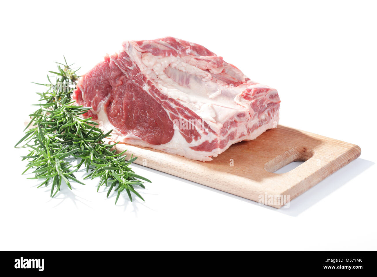Beef ribs and rosemary on a wooden cutting board Stock Photo