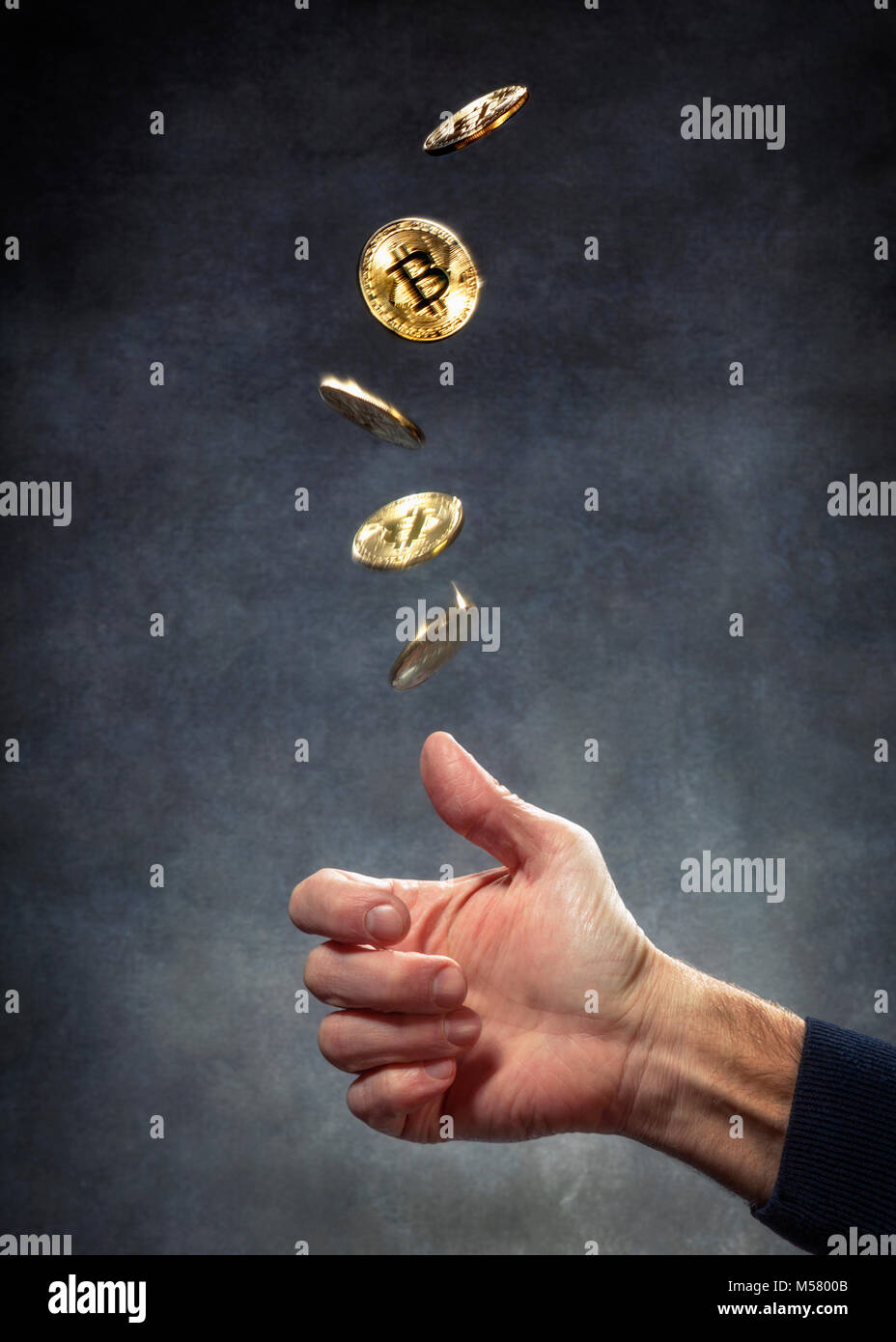 Bitcoin being tossed in the air Stock Photo Alamy