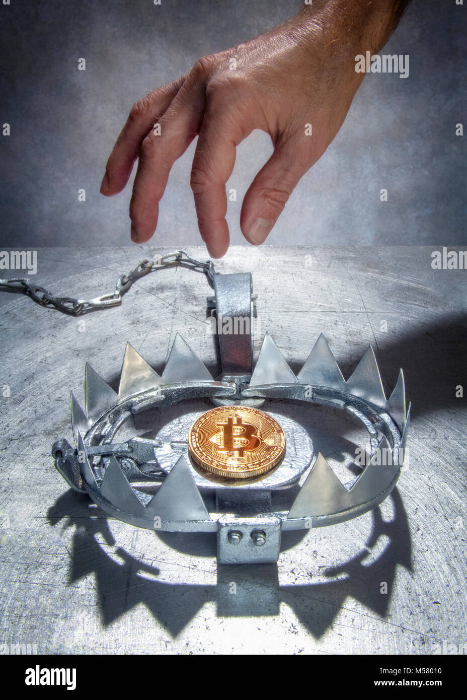Bitcoin on a bear claw trap Stock Photo - Alamy