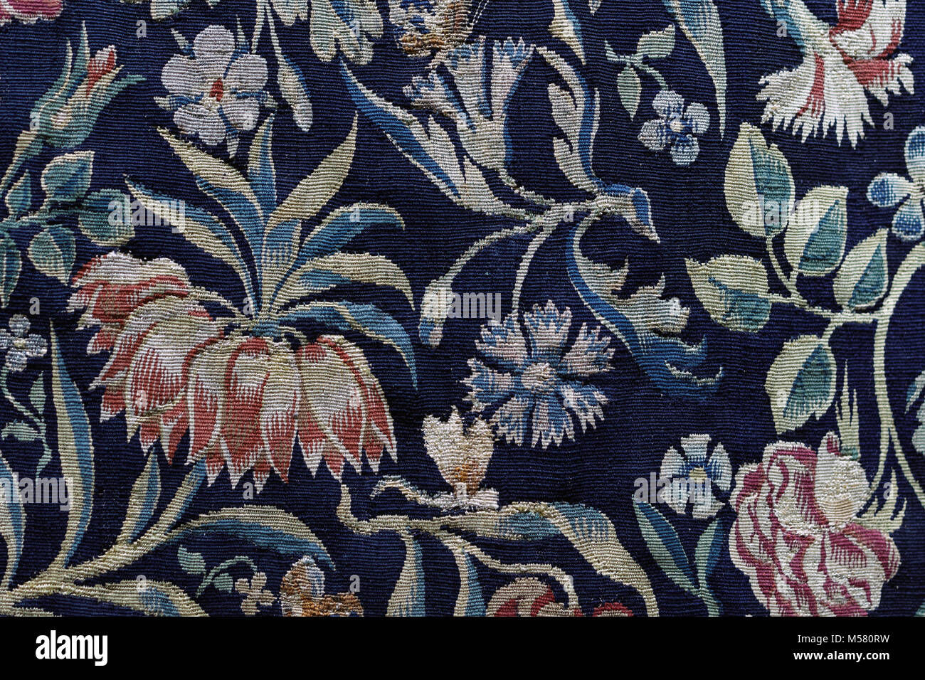 Old floral tapestry background in dark blue Stock Photo - Alamy
