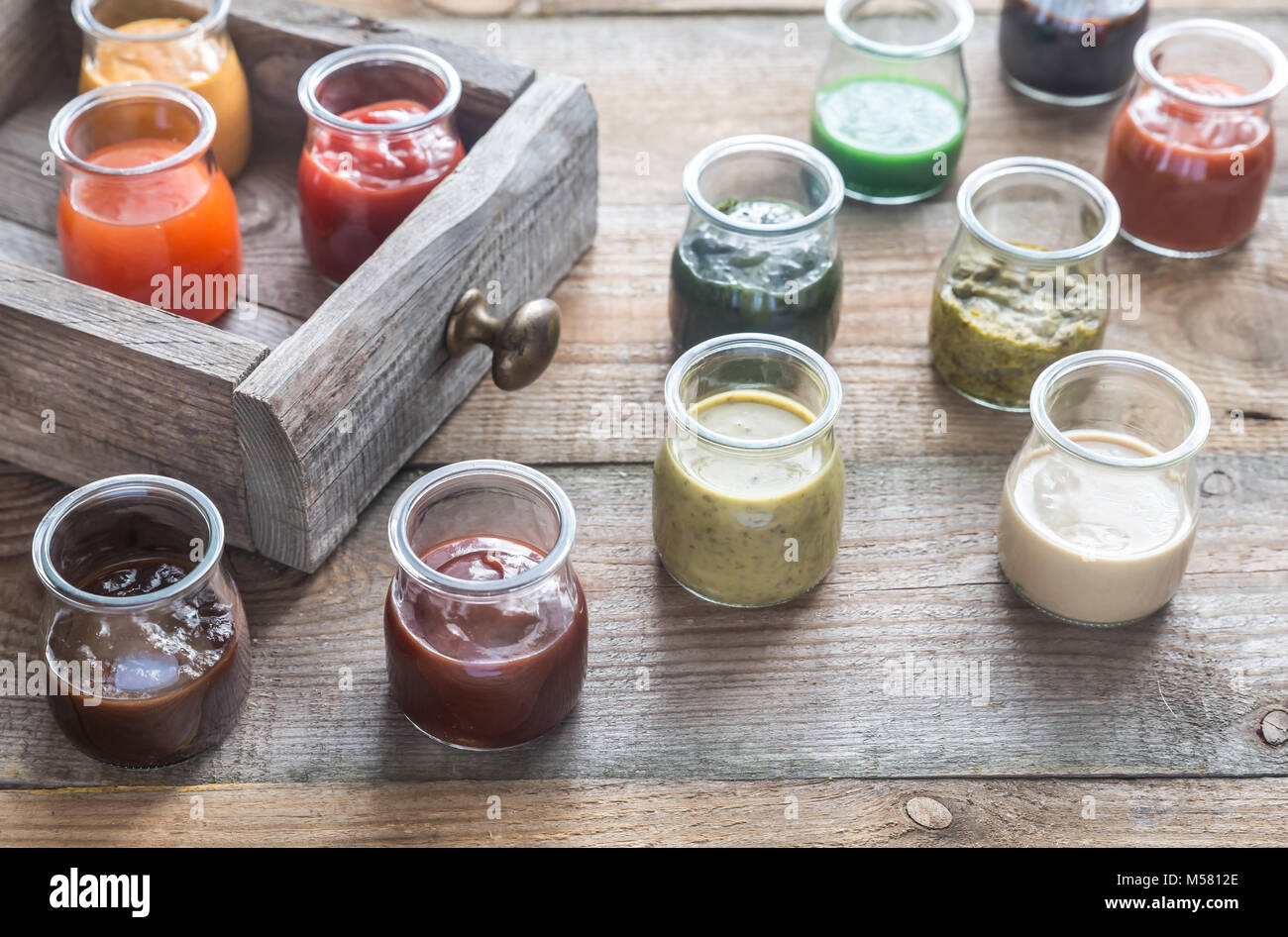 Assortment of sauces in the glass jars Stock Photo Alamy